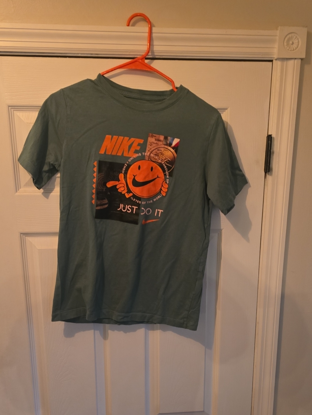 Nike Kids Green Graphic Tee with Orange Logo